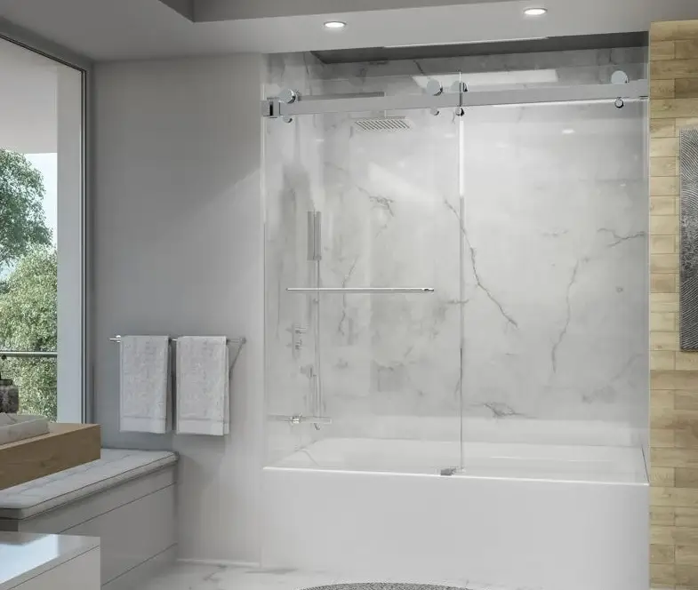 Bathtub sliding shower door with frameless glass panels and a sleek design in a modern bathroom with marble walls.
