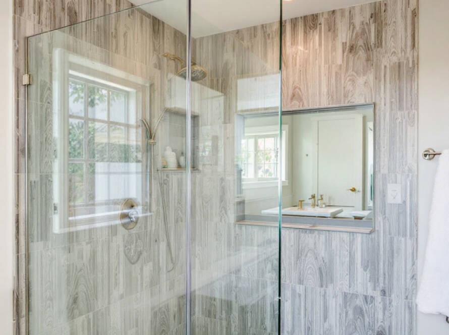 A perfectly installed frameless shower door presenting a contemporary design in Hopkinton, MA residence.