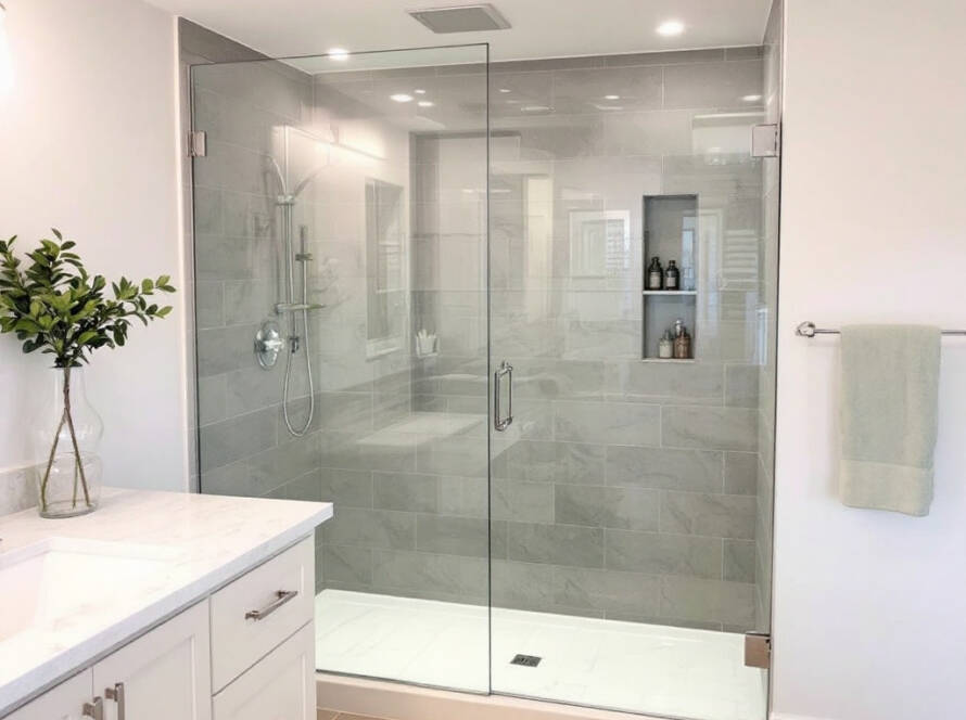 Frameless shower door installation showcasing the embodiment of modern and contemporary design in Norwell, MA.