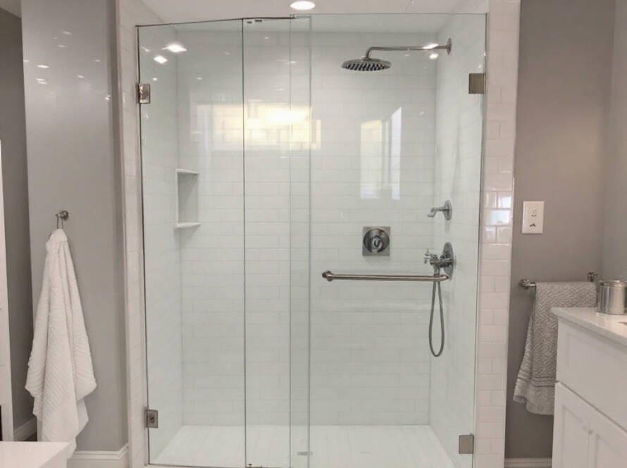 Custom frameless glass shower door in a sleek contemporary design in Cambridge, MA.