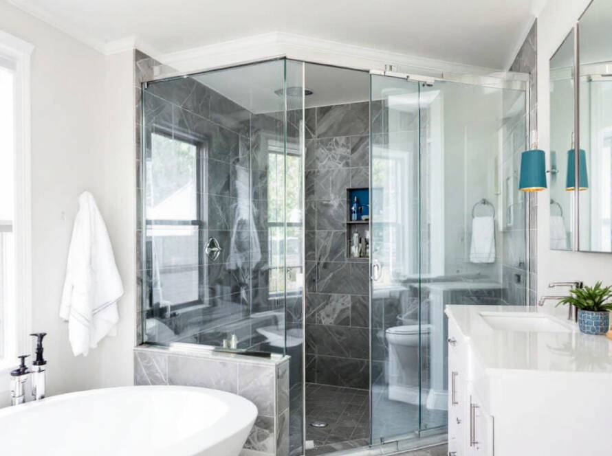 Artistic installation of modern, contemporary designed shower door in a Boston home.