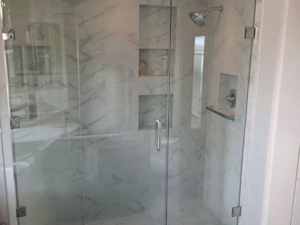 Skilled workmen installing a modern and elegant shower door in a residence near Hingham, MA.