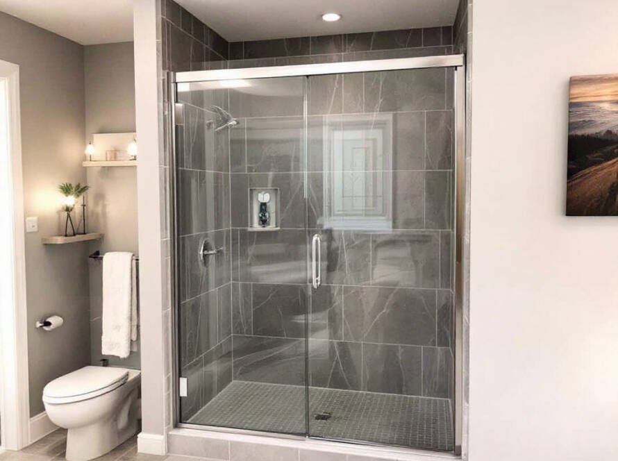 Custom, modern semi frameless shower door design installed in a contemporary bathroom.