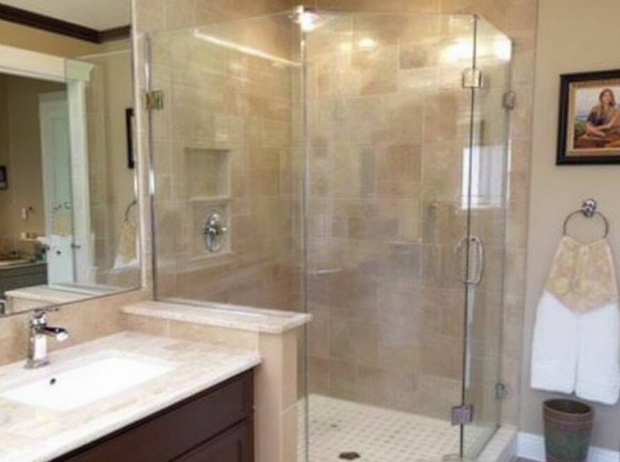 Glass shower door installation transforming a bathroom into a modern, contemporary space in Needham, MA by Deluxe Shower Doors.