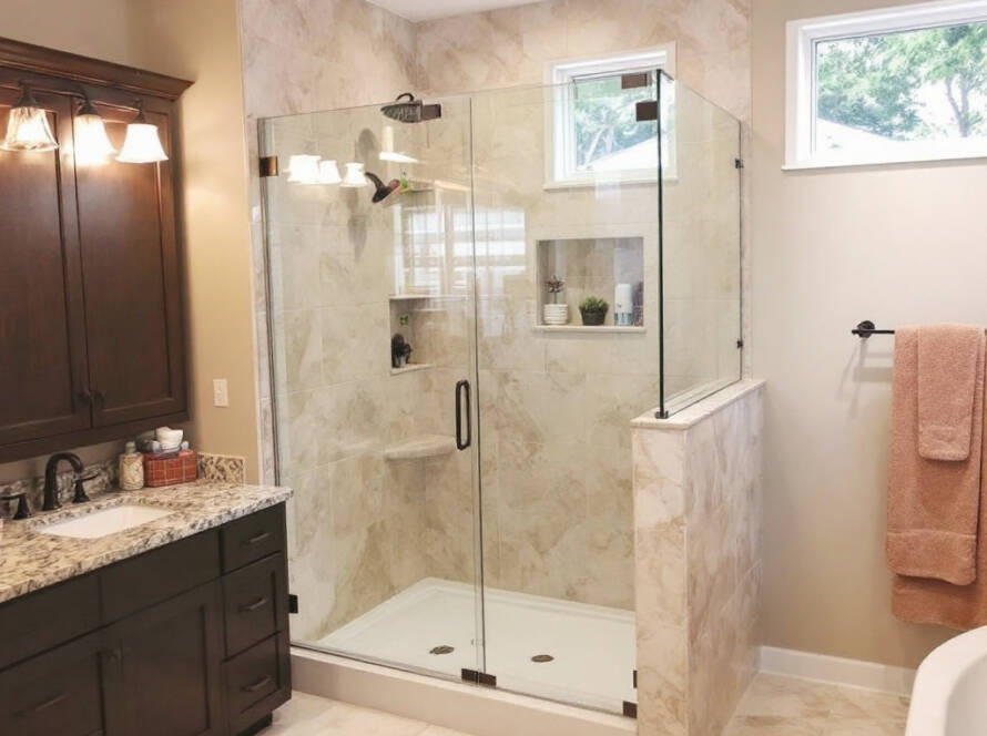 An expert working on the installation of a state-of-the-art shower door in modern design near Braintree, MA.