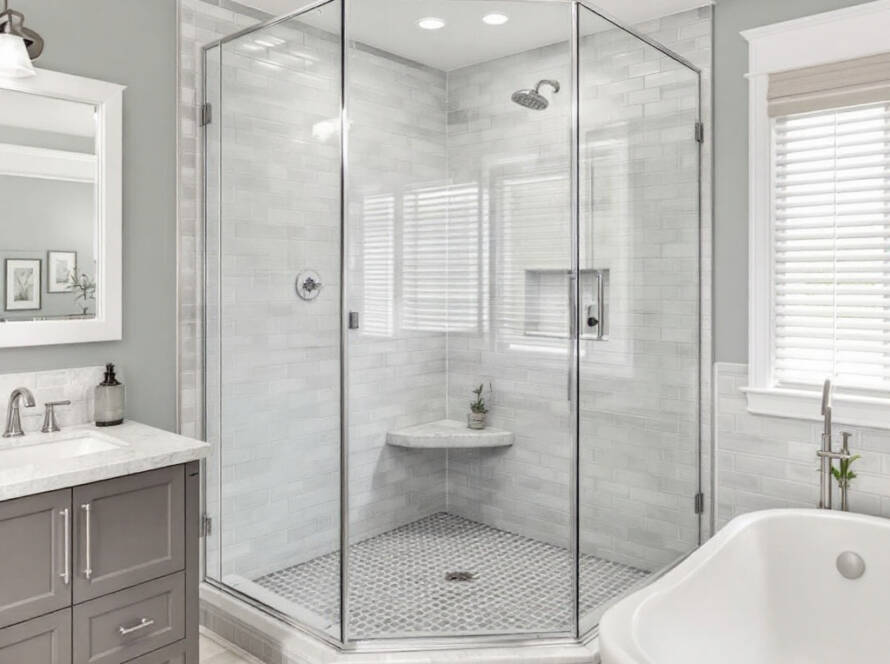 Skilled professionals installing a custom-made shower glass in a contemporary styled bathroom located in Acton, MA.