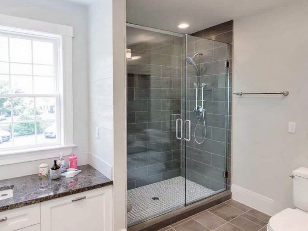 'Custom elegant frameless shower enclosure installation service available in Waltham, MA.'