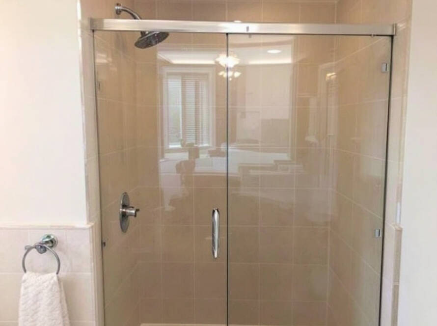 Professional shower door installers demonstrating their expert craftsmanship in Avon, MA with a modern and contemporary design.