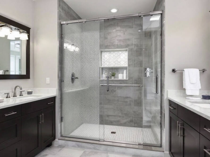 Innovative process of custom-designed shower door glass installation in a modern Boston's premier bathroom.