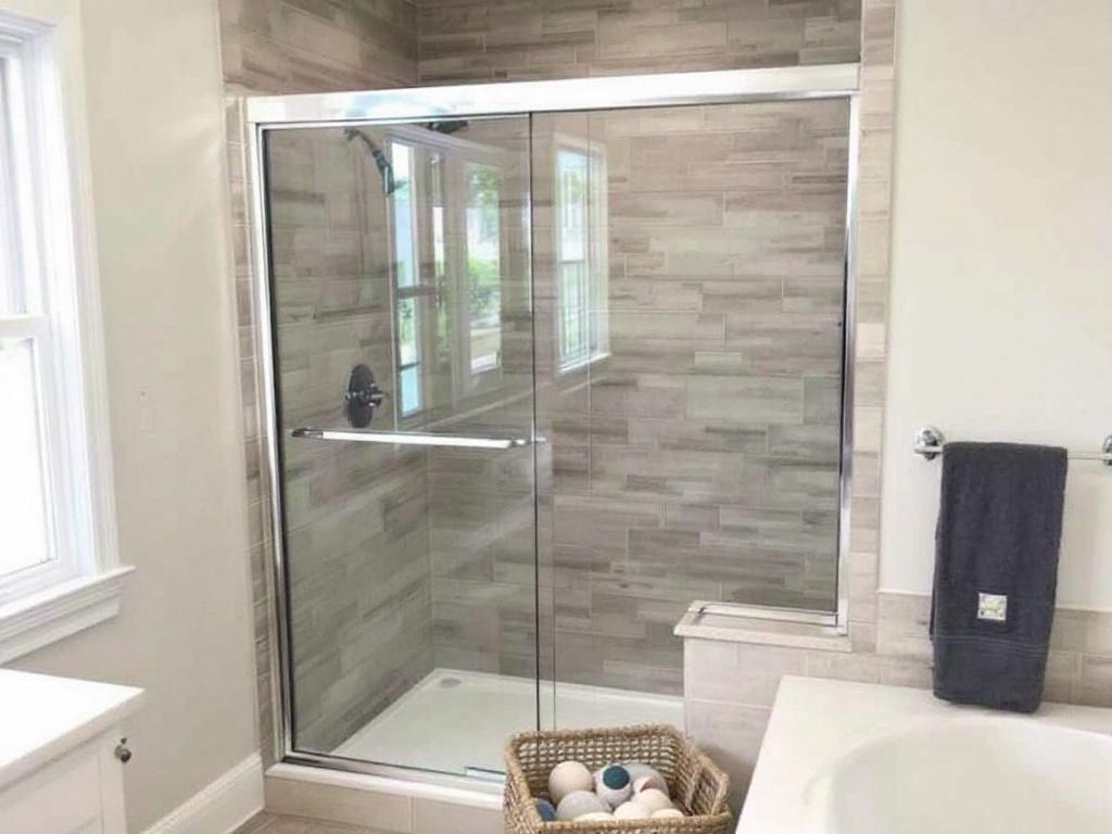 Professional sliding shower door installer performing installation work in Wakefield MA.