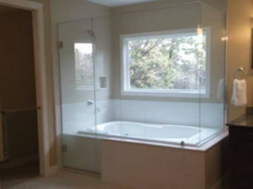 Expert shower glass installation featuring a modern and contemporary design in a newly transformed spa-like bathroom in Acton, MA.