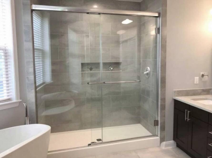 Expert installers showcasing modern sliding shower door installations in Dedham, MA.