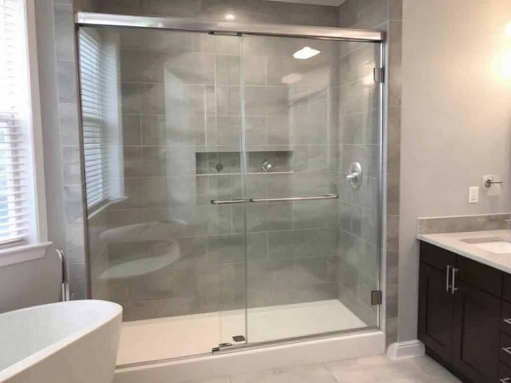 Expert installers showcasing modern sliding shower door installations in Dedham, MA.