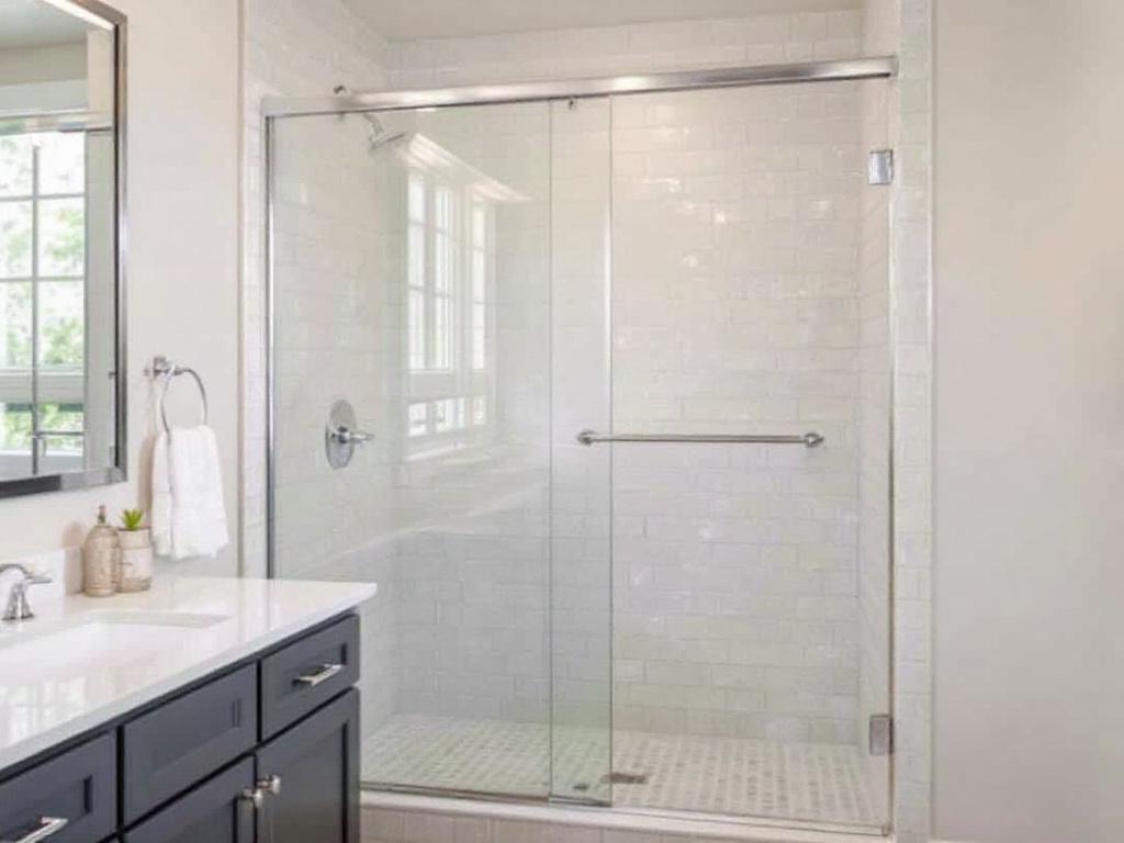 Expert sliding shower door installers in Dedham, MA holding a complete guide.