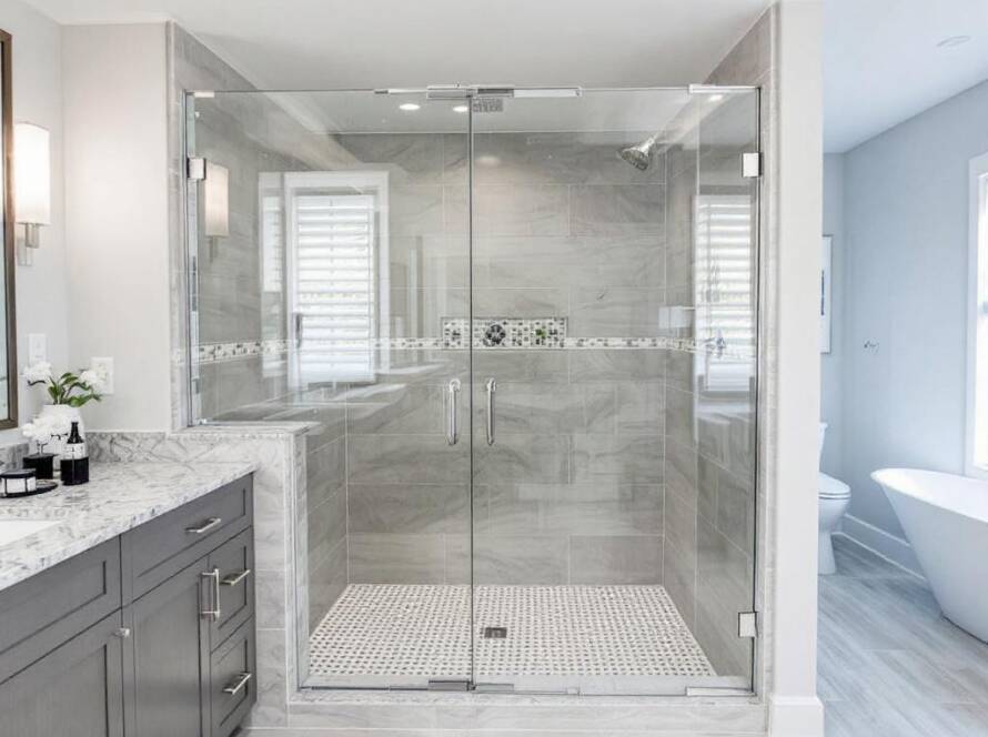 An avant-garde, contemporary design of custom glass shower doors installed by Atlantic Shower Door's expert craftsmen.