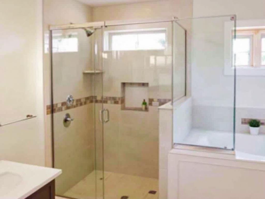 Expert tradesmen installing modern sliding shower doors in Woburn, MA, transforming bathrooms into contemporary havens of awesomeness.