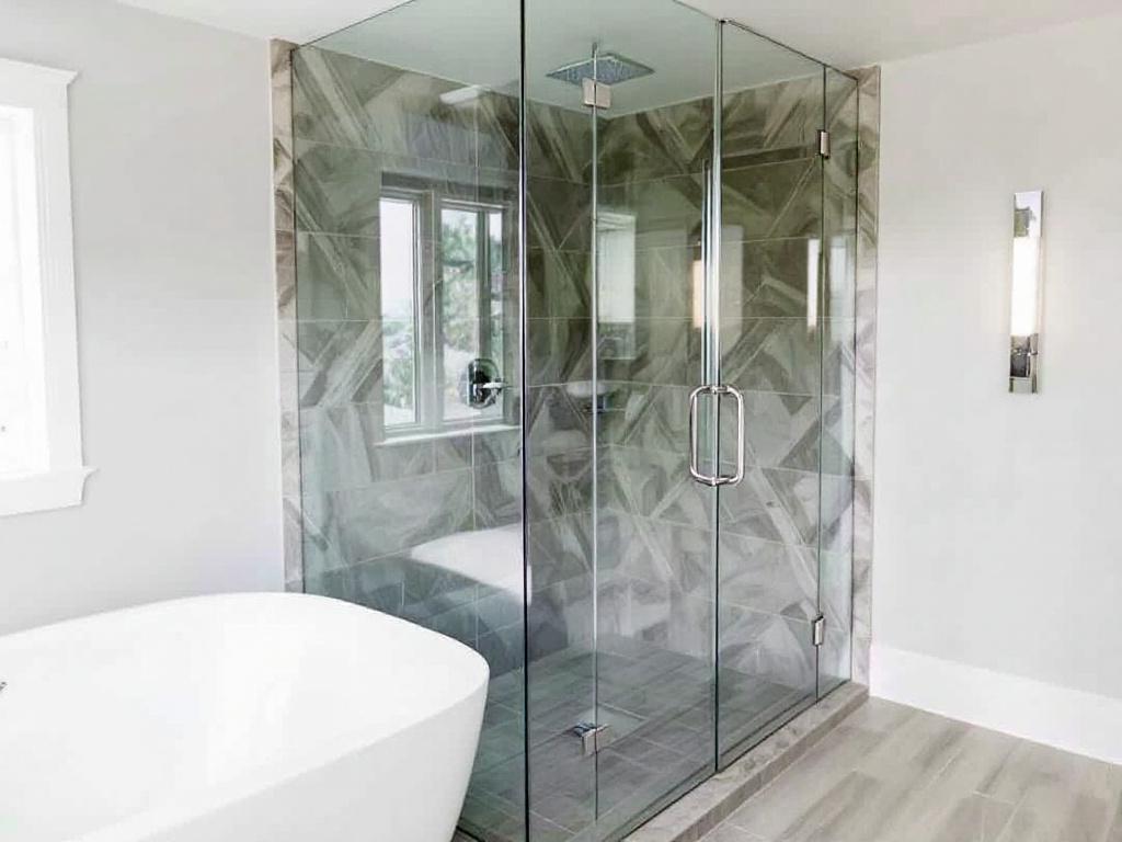 Frameless shower glass addition enhancing a bathroom interior in Saugus, MA.