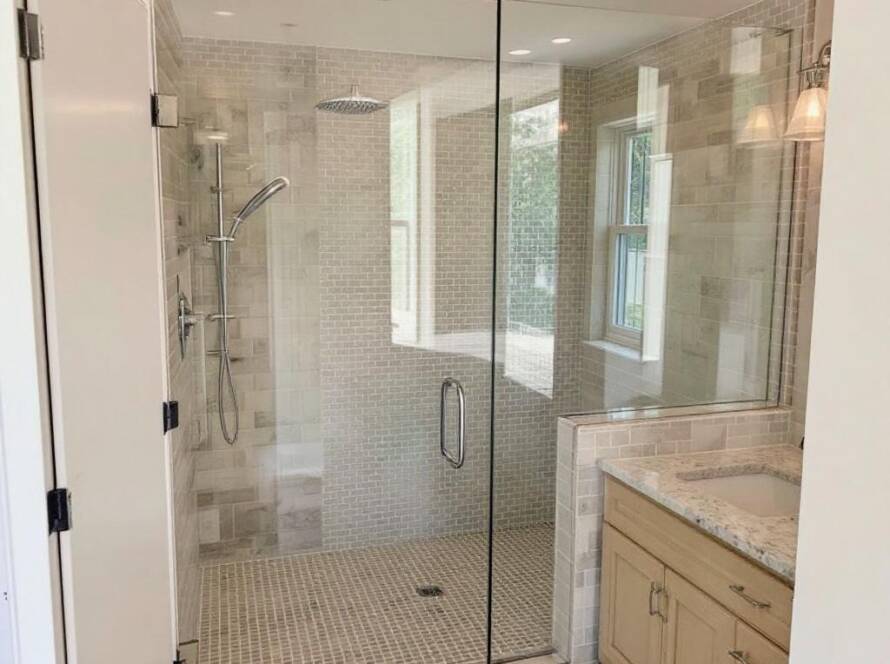 A newly installed modern, contemporary designed shower glass door in Canton, MA by Unbeatable Expert Solutions.