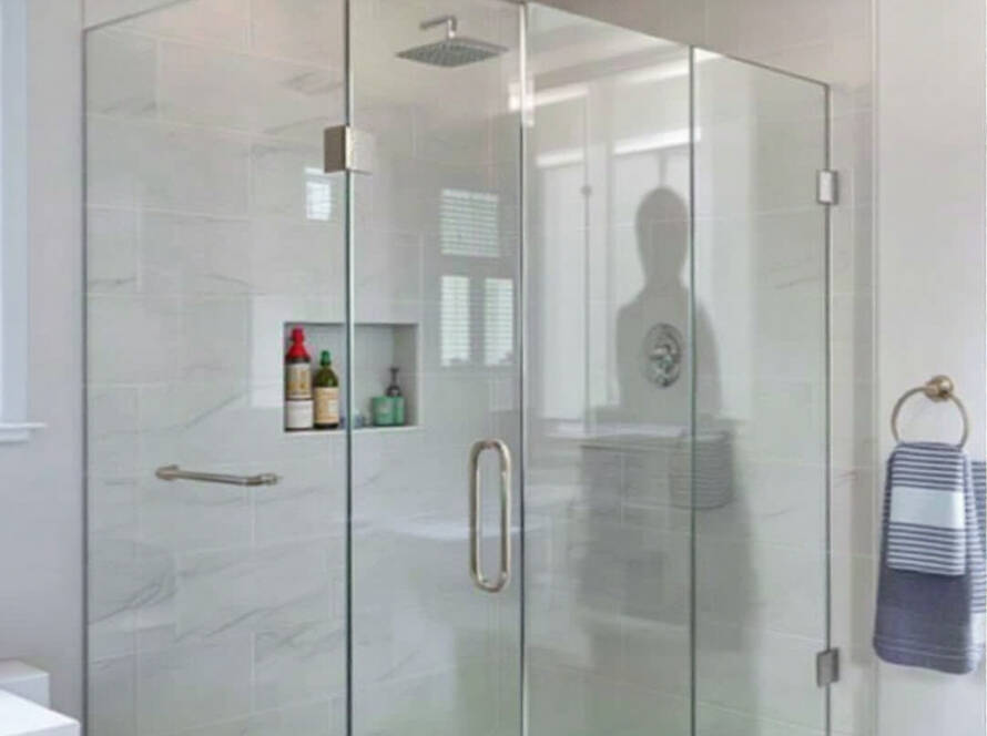 Alt Text: Elegant frameless shower door with a sleek, modern design in Hopkinton, MA.