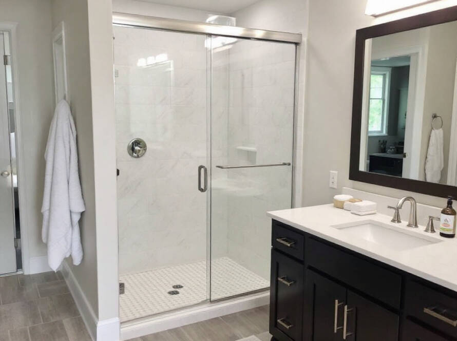 Expert installers doing sliding shower door installation in Stoneham, MA for the latest contemporary design.