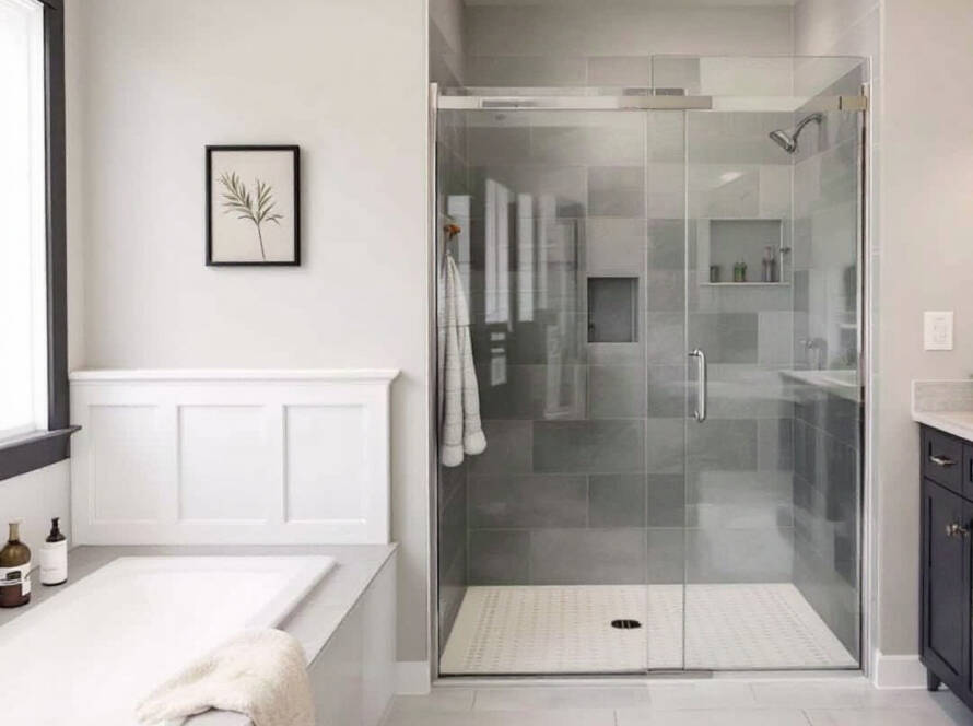 Newly installed modern semi-frameless shower doors, showcasing a contemporary design.